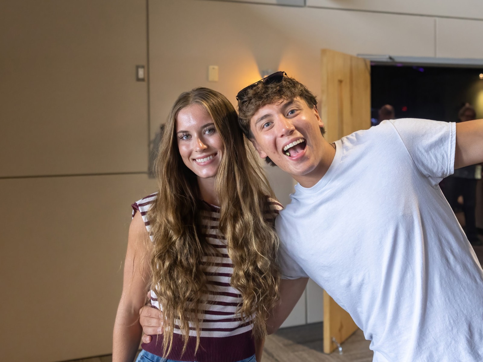 Two students laughing together at church